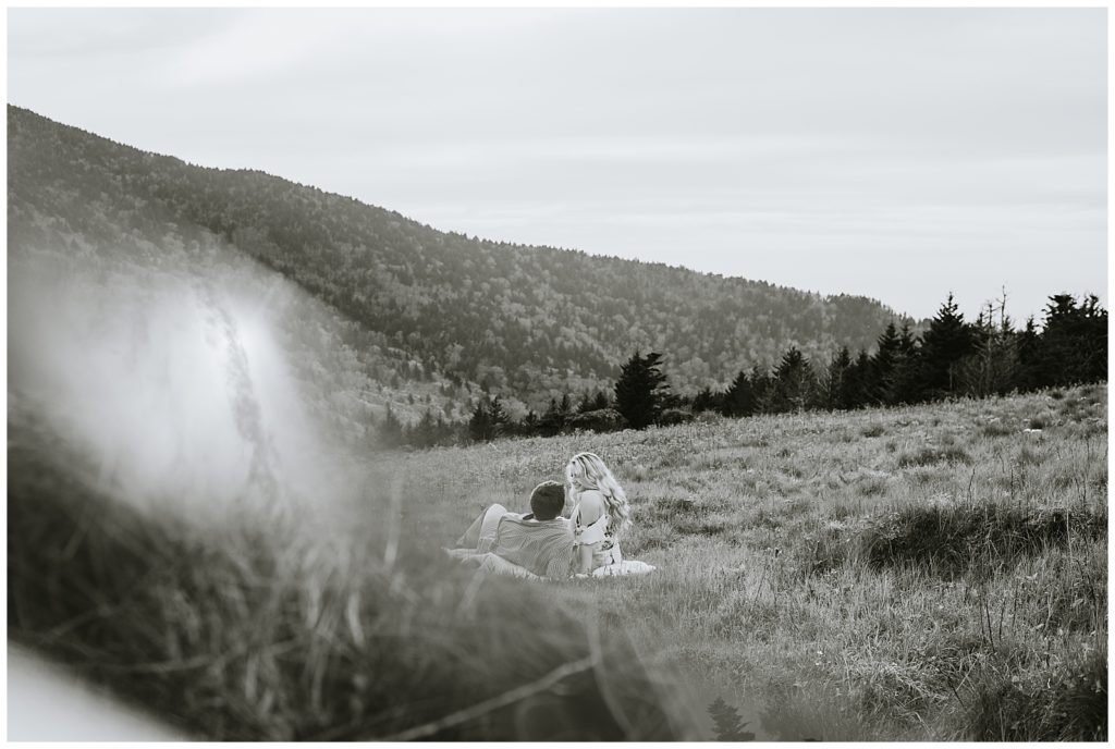 moody black and white photo of a couple in the mountains