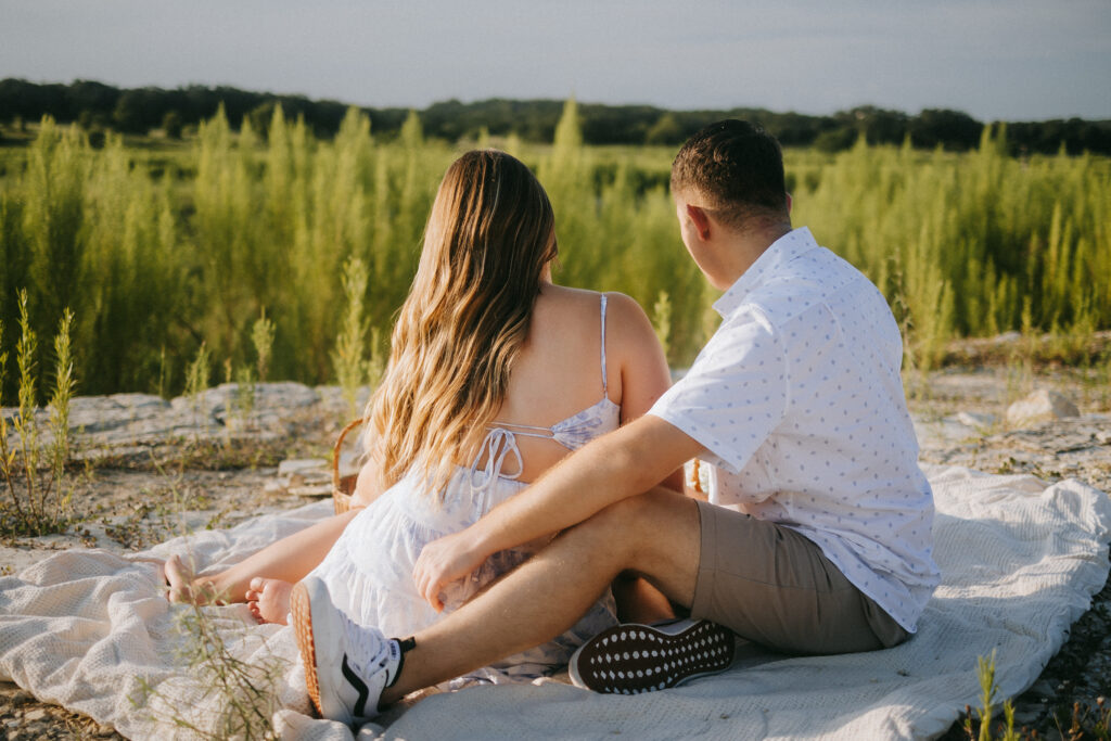 Candid photograph of Hailey and Tanner together during their engagement picnic