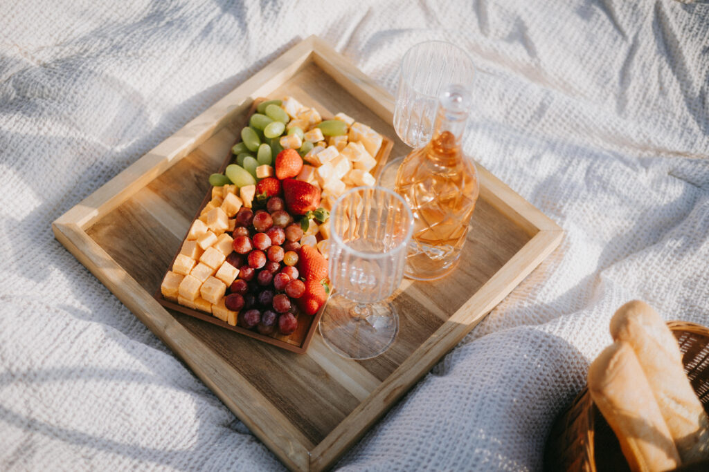 Romantic picnic details arranged for an outdoor engagement session in Texas