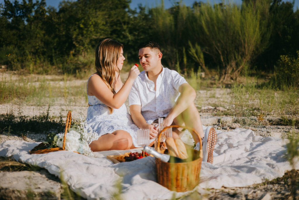 Hailey and Tanner relaxing together during their picnic engagement session