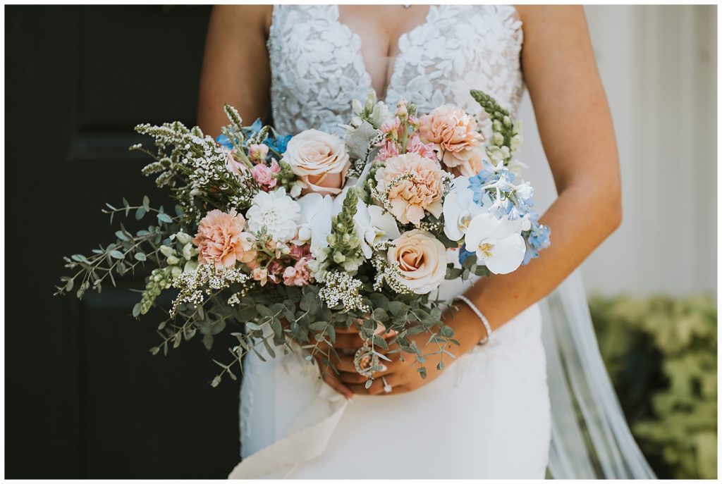 gorgeous wedding flowers being held by bride